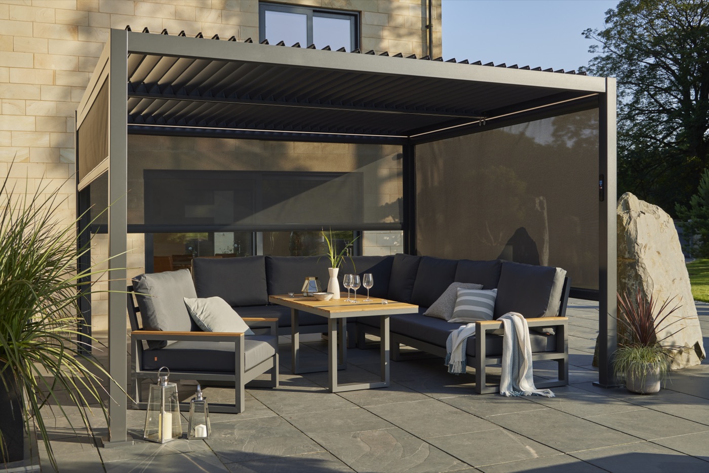 Textilene side screens deployed on the pergola for wind and sun protection