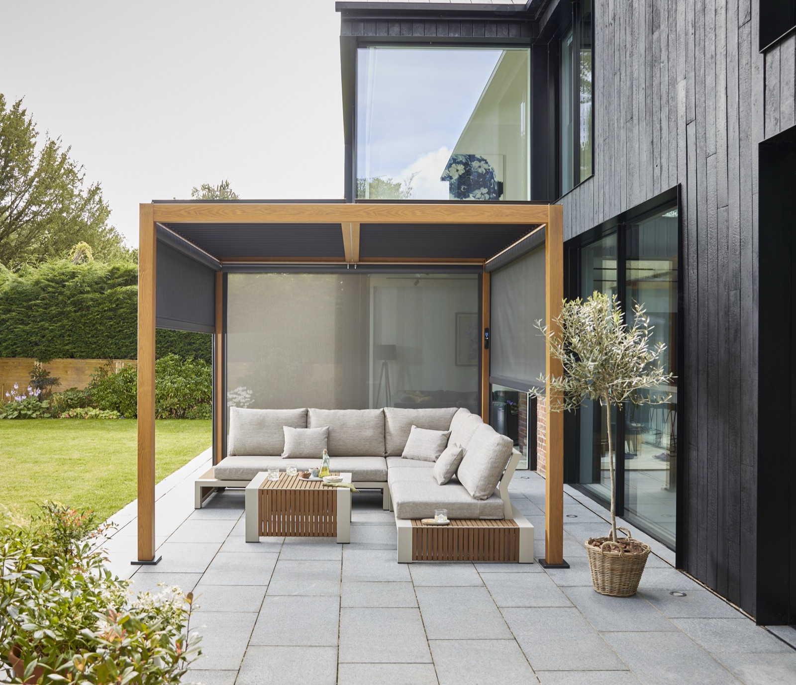 Wood-look pergola with side screens drawn for shelter