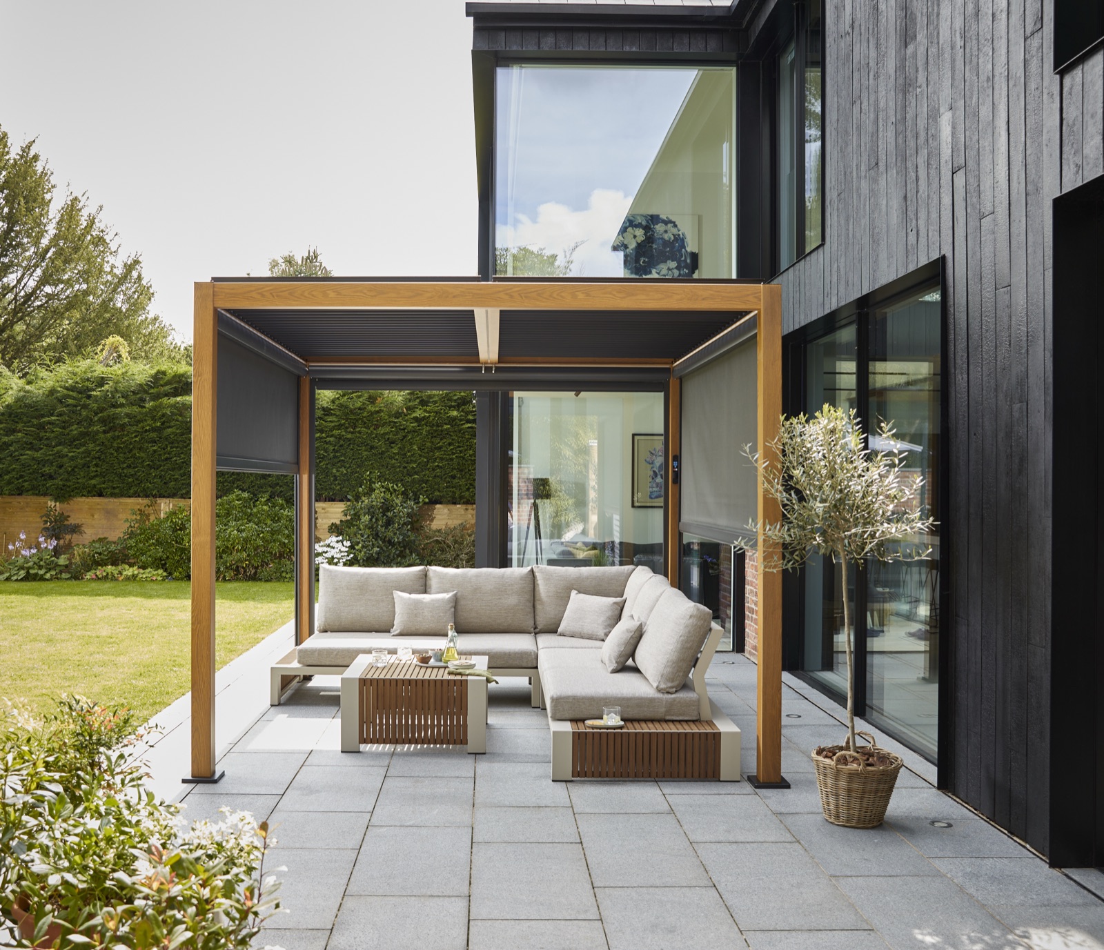 Wood-look pergola with roof partially open